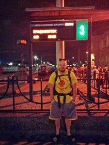 in front of the sign saying "moscow staying" displaying train 100 going across the country