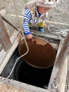 The 2nd youngest getting water from the well