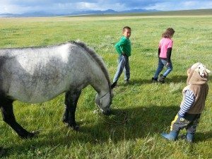 3 of the kids and a horse