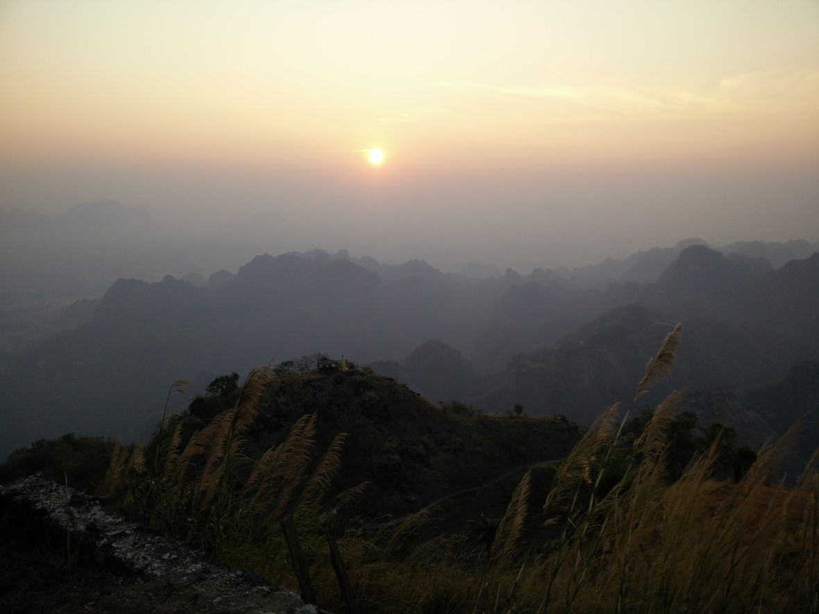sunset at top of mt zwegabin in myanmar