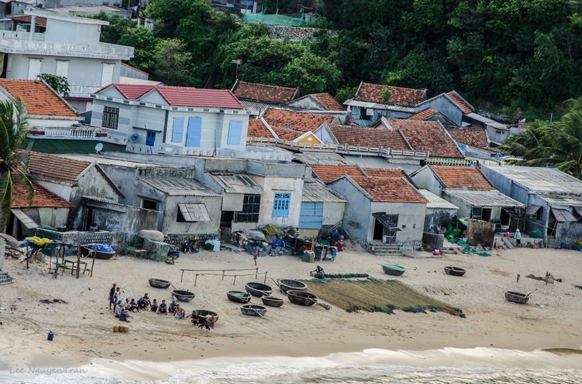 fishermen getting ready in the morning at red reef beach, phu yen, vietnam